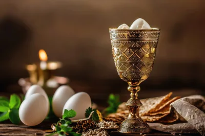 Passover Seder Table Setting with Matzah and Eggs