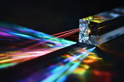 Red Laser Beam Refracting Through A Glass Prism