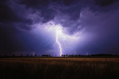 Powerful Lightning Strike Over A Dark Rural Field