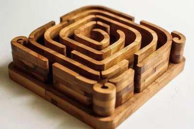 Wooden Spiral Maze Puzzle on White Background