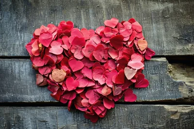 Heart Shape Made Of Red Petals On Wooden Background