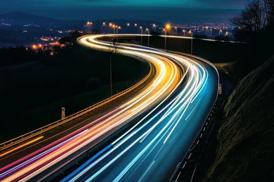 Long Exposure Light Trails On A Winding Highway