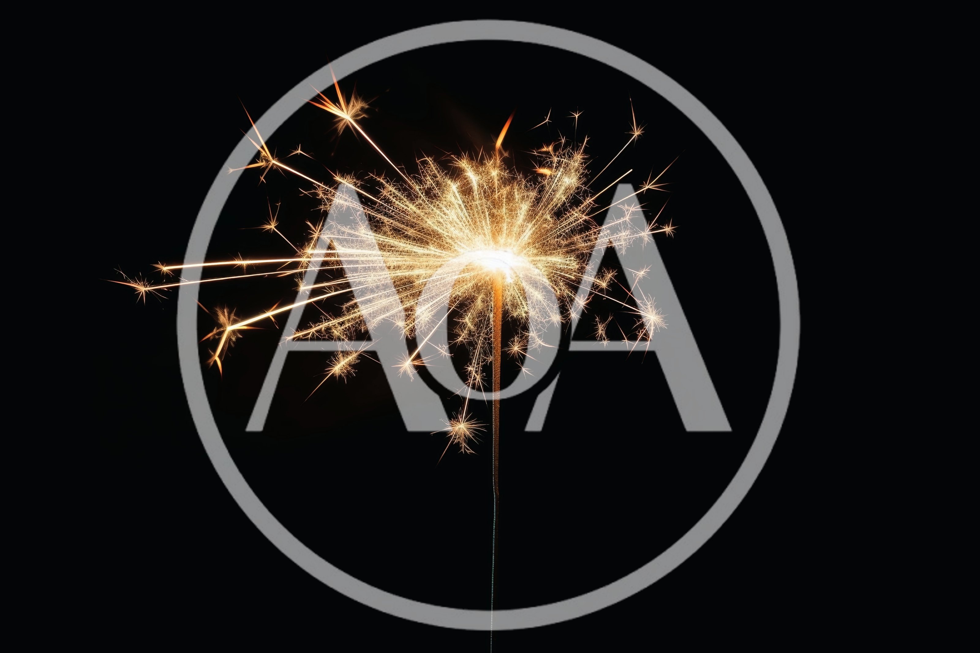 Bright Burning Sparkler Against A Solid Black Background