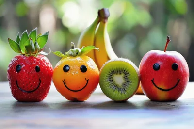Smiling Fruit Characters Arranged On A Wooden Table