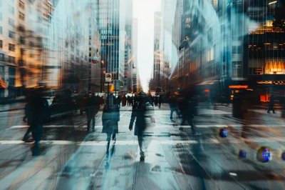 Blurred Pedestrians Walking Across A Busy City Intersection