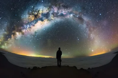 Silhouette Of A Person Standing Under The Milky Way