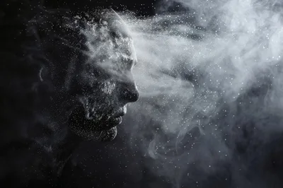 Profile Of A Human Face Dissolving Into Smoke
