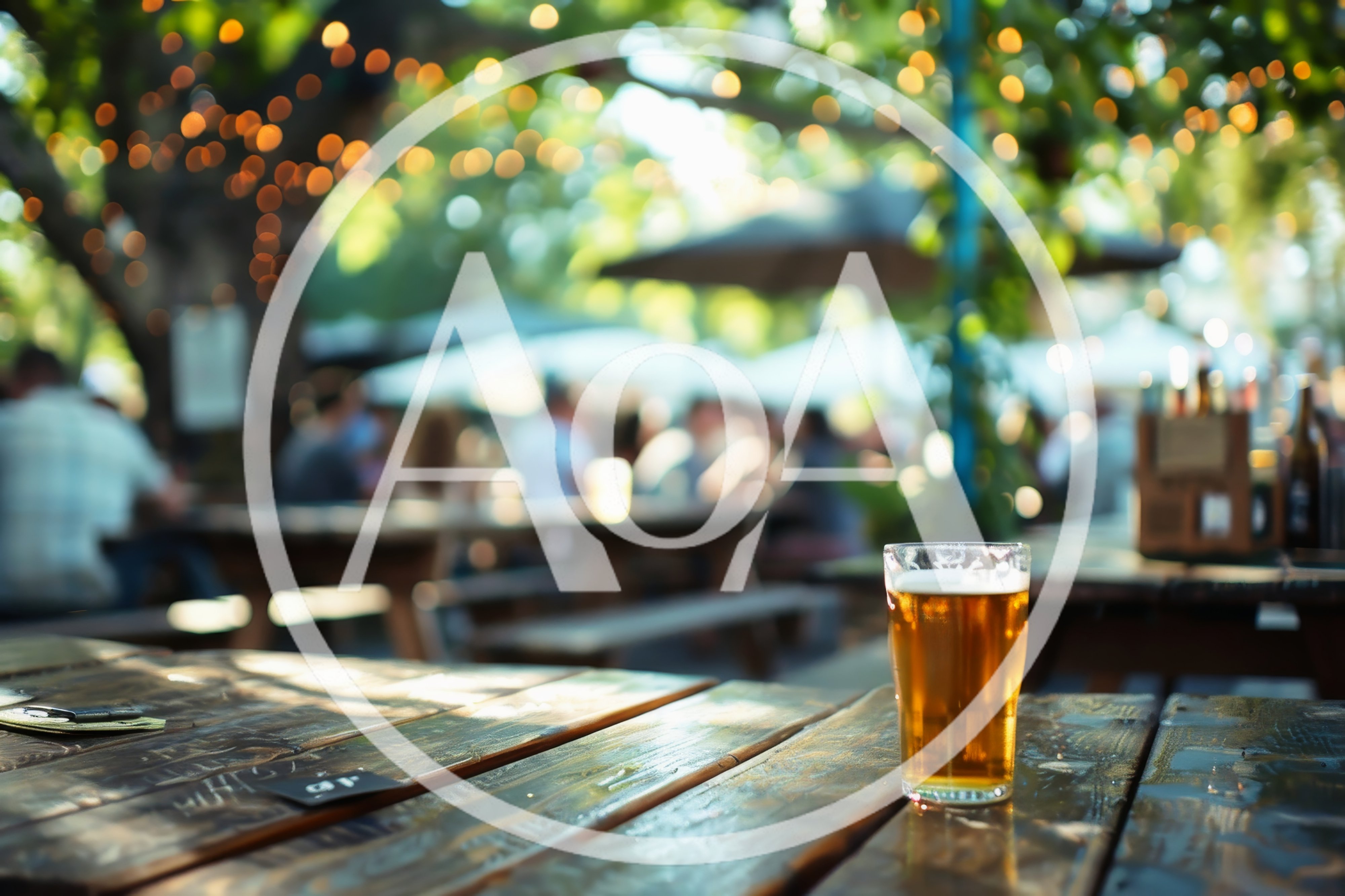 Glass Of Beer On A Wooden Table At An Outdoor Beer Garden