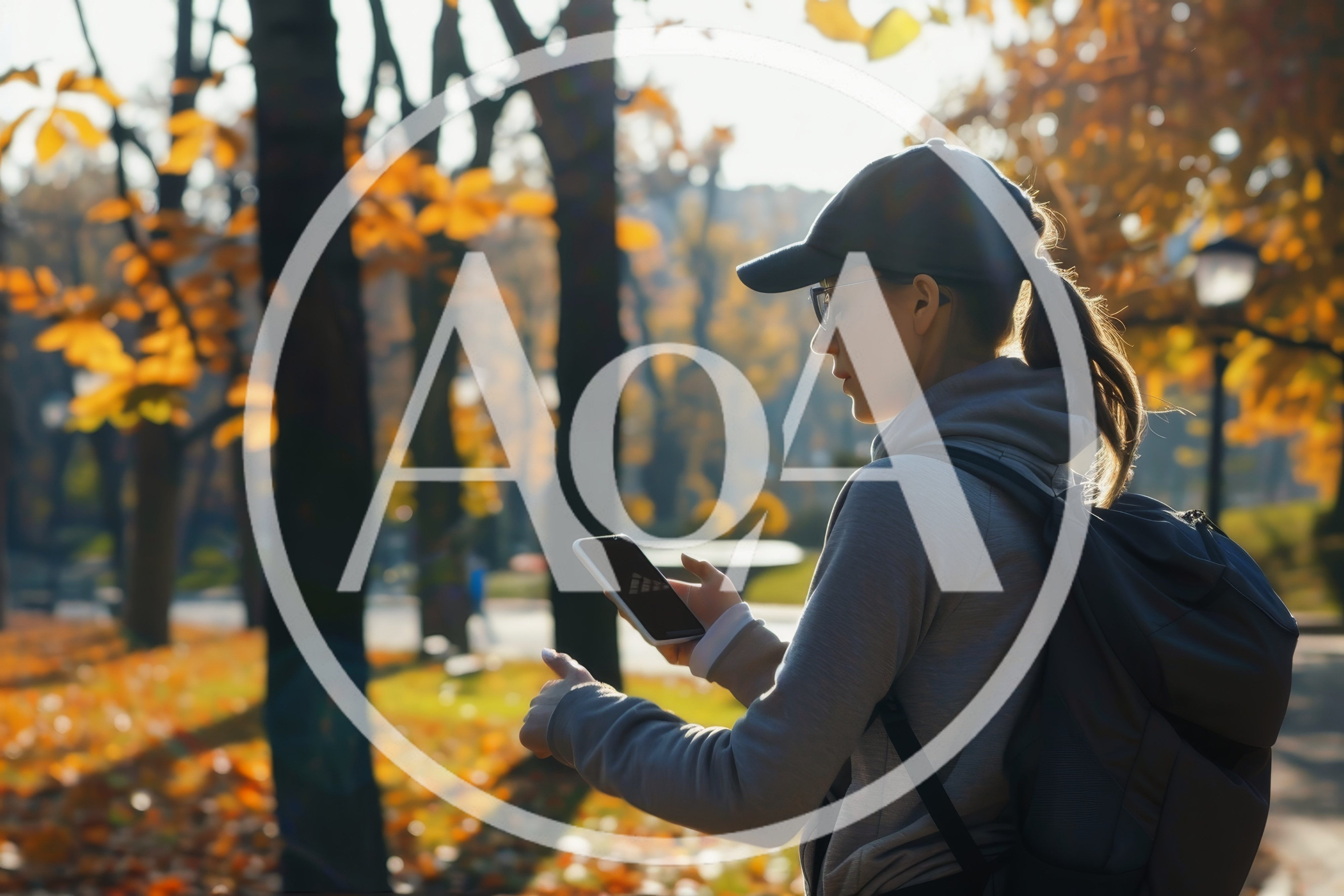 Young Woman Using Smartphone In Autumn Park