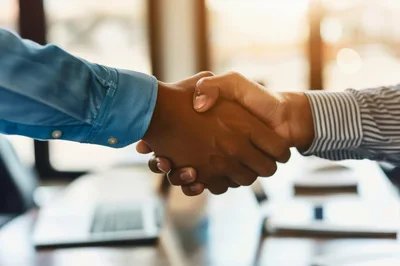 Professional Business Handshake In A Modern Office Setting