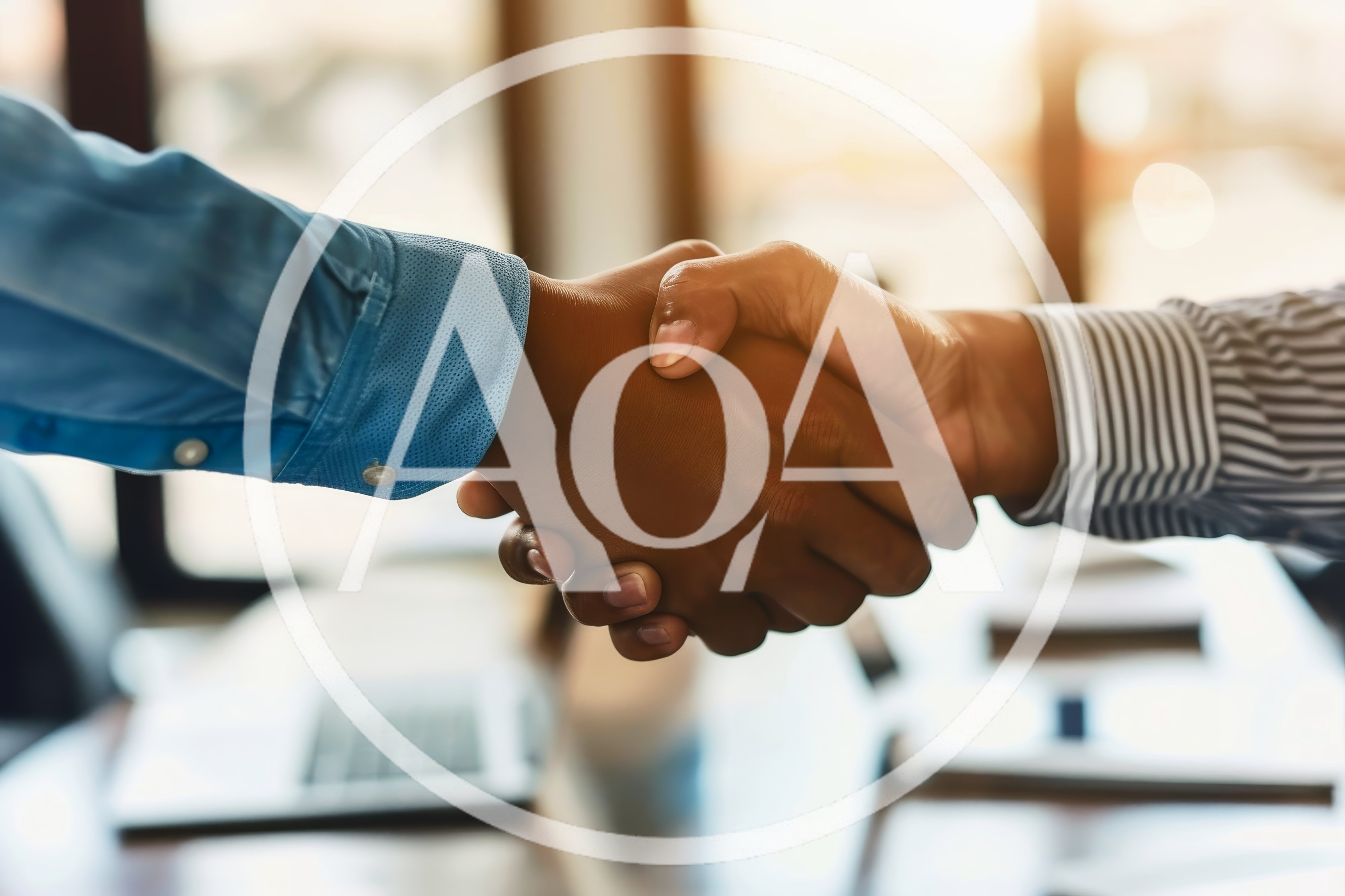 Professional Business Handshake In A Modern Office Setting