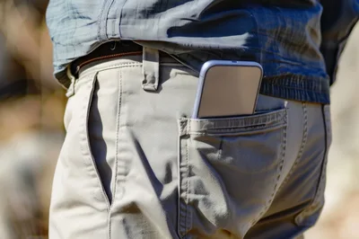 Smartphone Sticking Out Of A Man's Back Pocket
