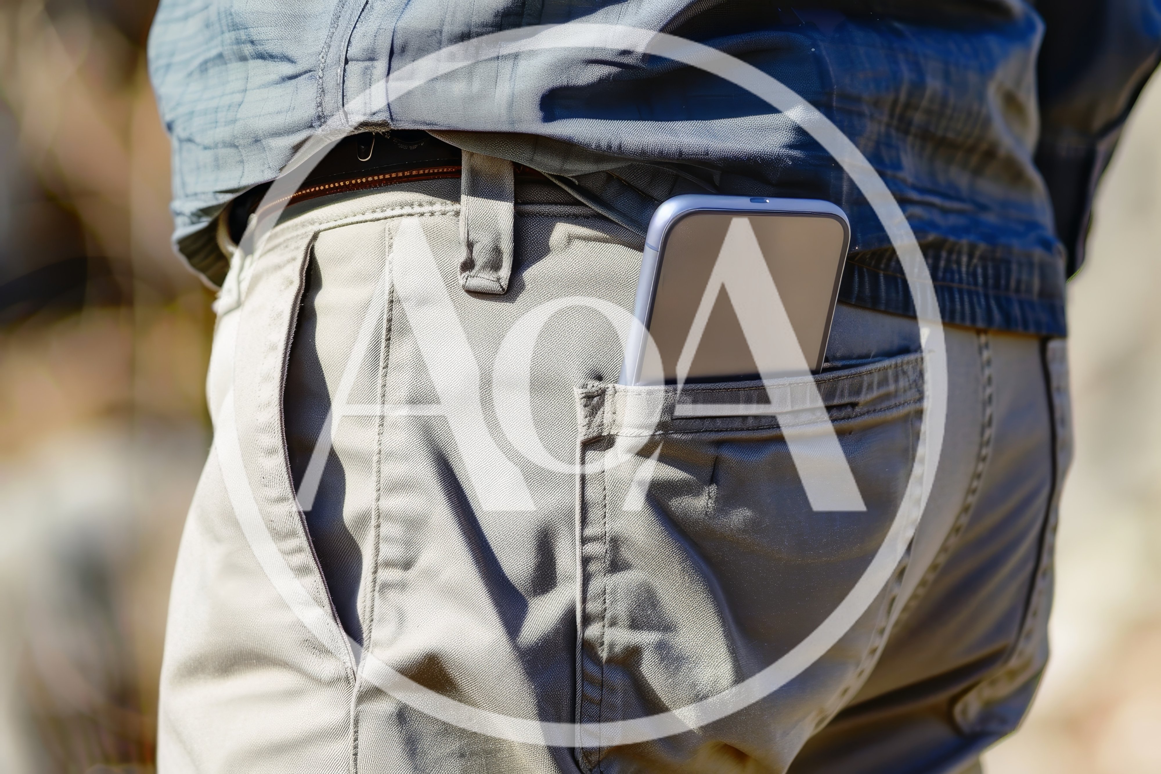 Smartphone Sticking Out Of A Man's Back Pocket
