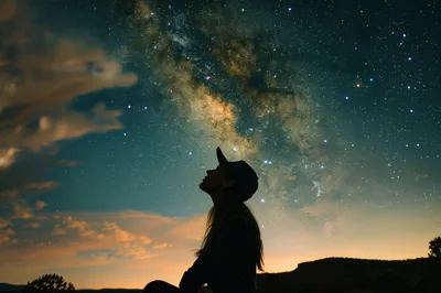 Silhouette Of A Woman Looking At The Milky Way