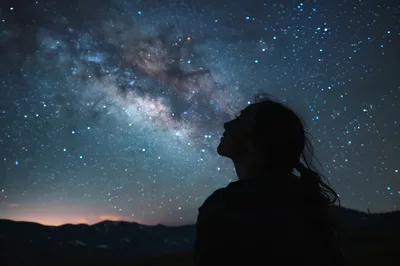 Silhouette Of A Woman Gazing At The Milky Way