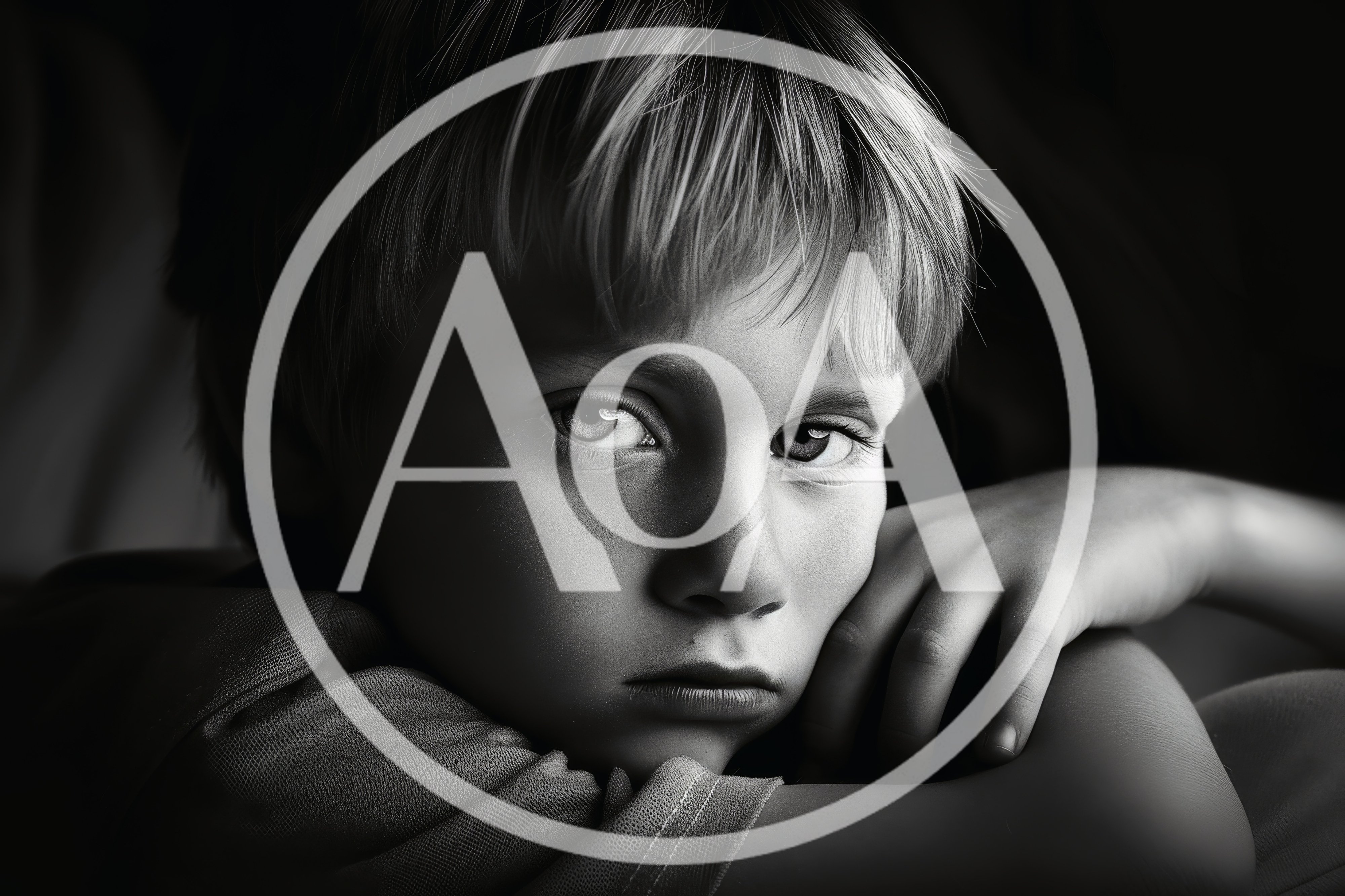 Portrait Of A Pensive Young Boy In Black And White