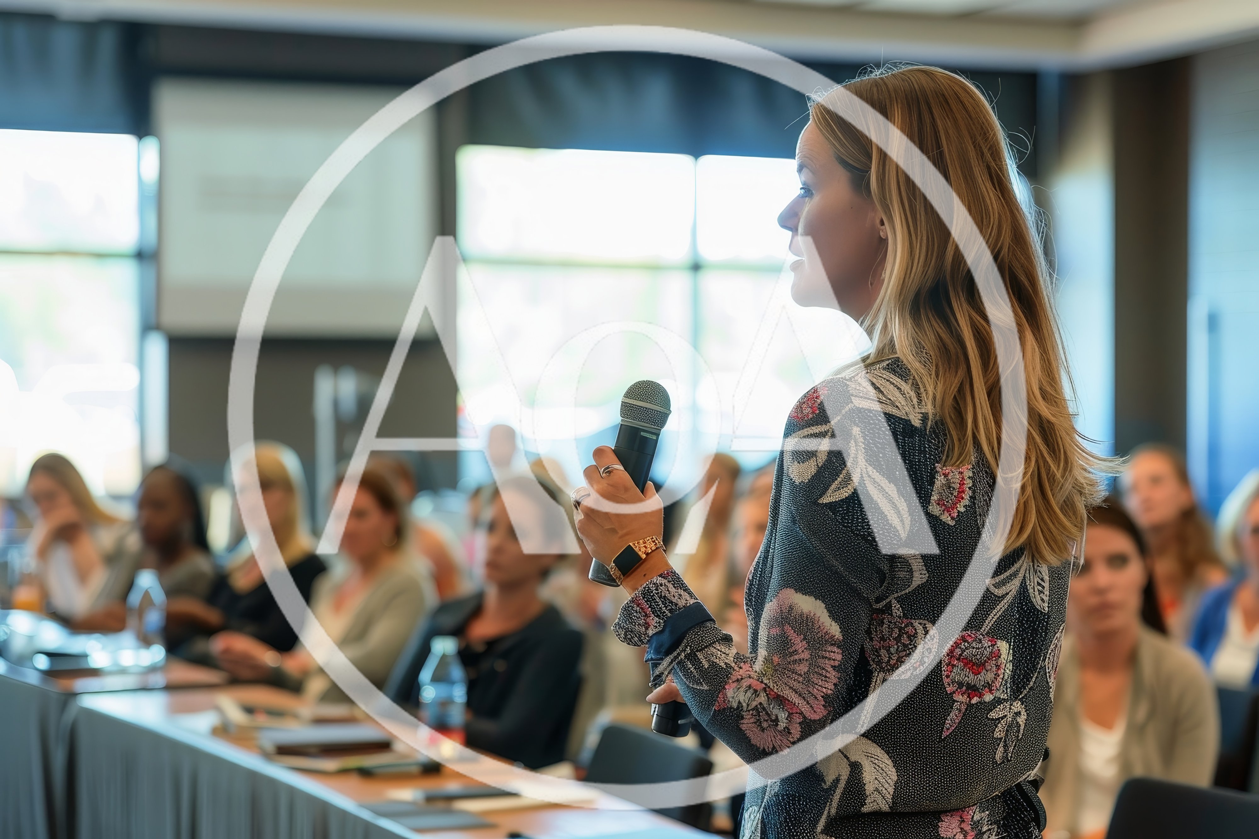 Professional Woman Speaking At A Business Conference