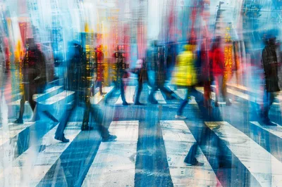 Abstract Motion Blur Of Pedestrians Crossing A City Street