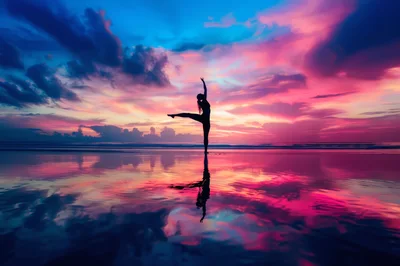 Silhouette Of A Woman Practicing Yoga On The Beach