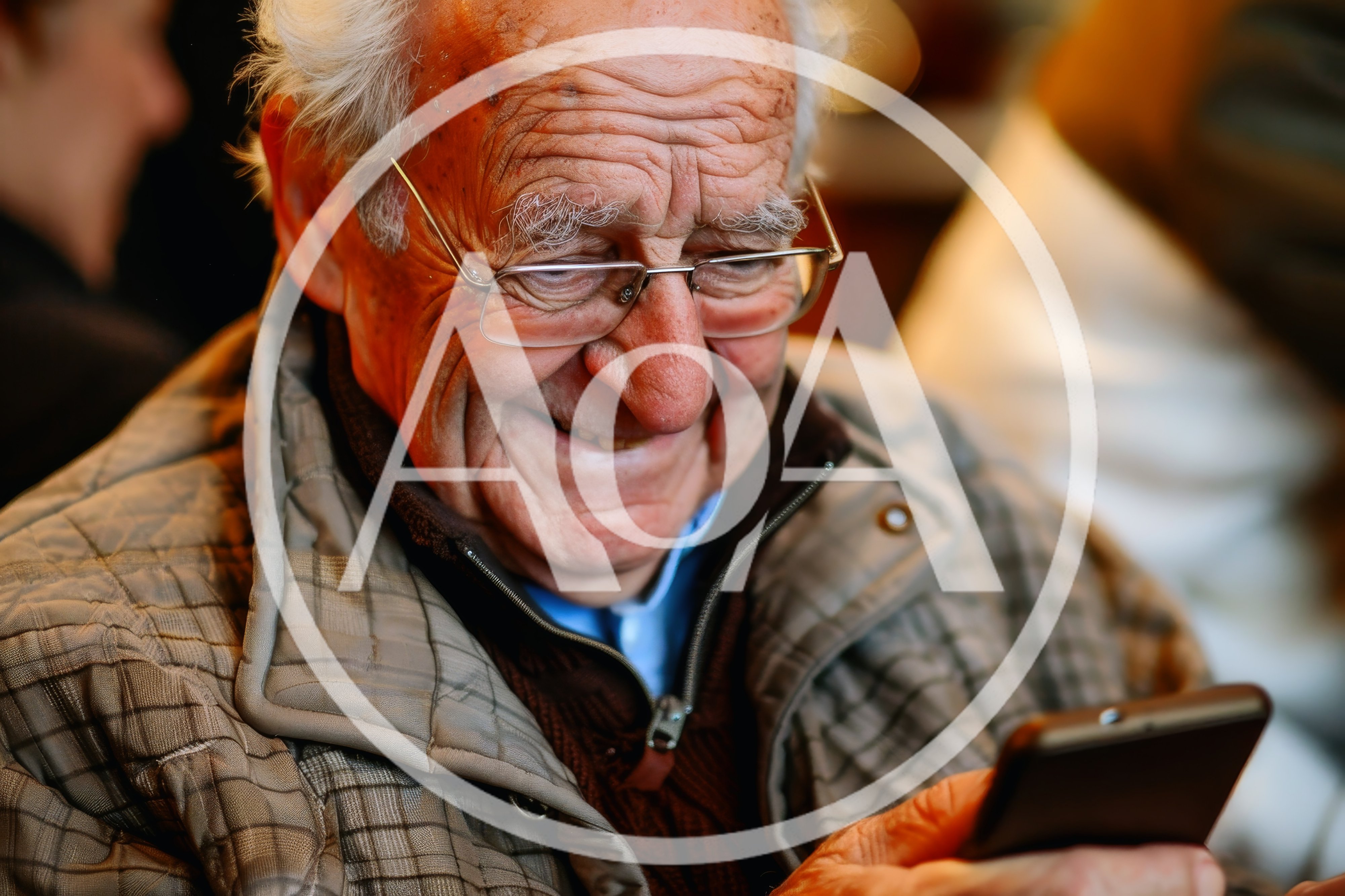 Elderly Man Smiling While Using A Smartphone