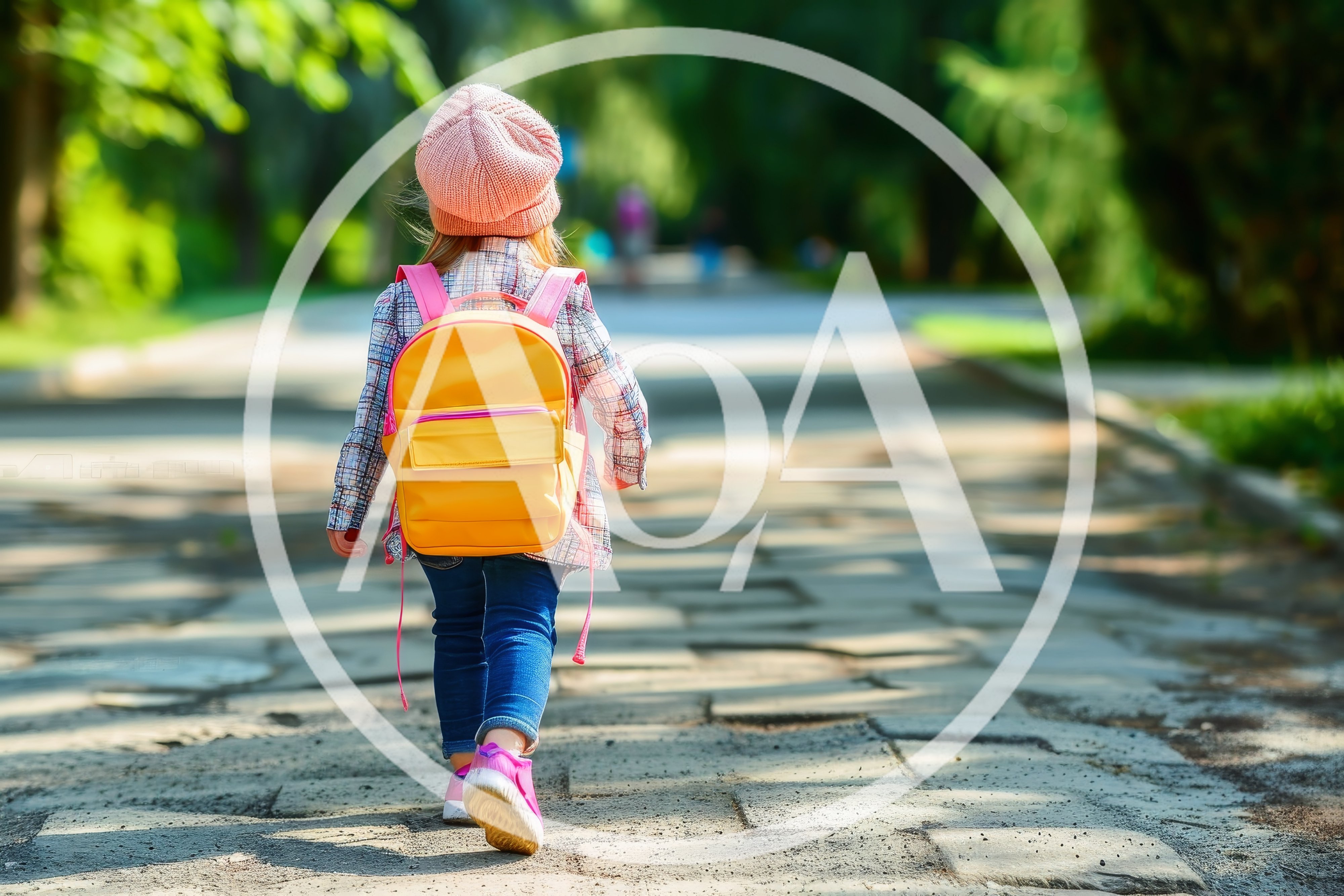 Little Girl Walking Down A Park Path With Backpack