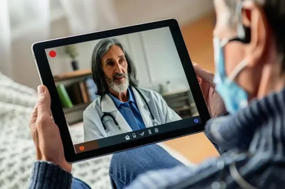 Senior Patient Having Telemedicine Consultation With Doctor