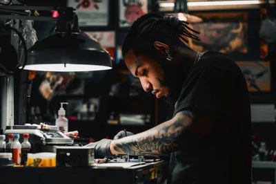 Tattoo Artist Working In A Professional Studio
