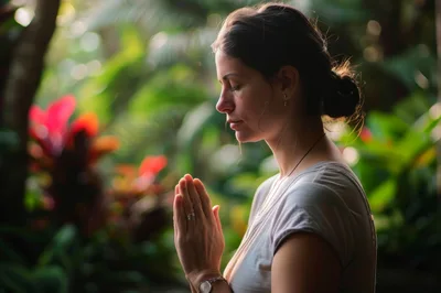 Woman Meditating With Hands In Prayer Position