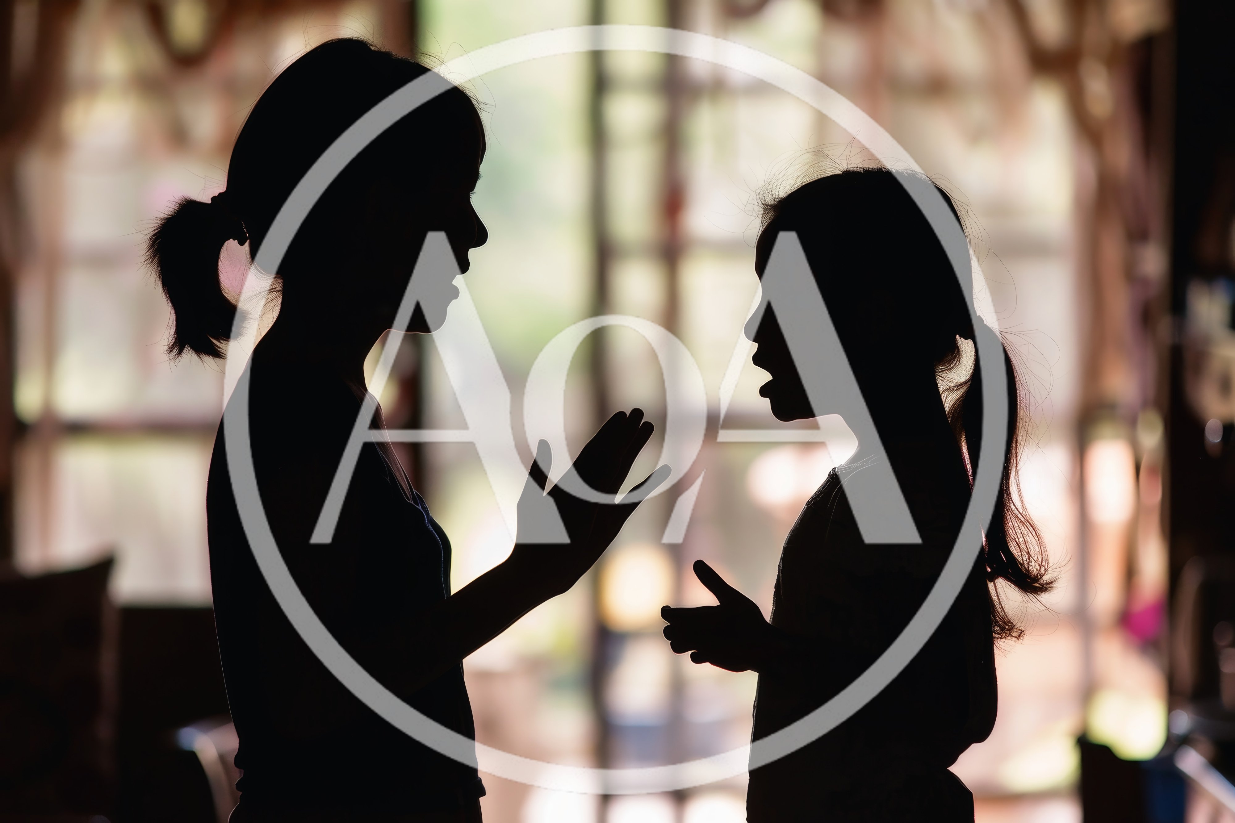Silhouette of Mother and Daughter Talking