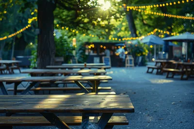 Empty Wooden Picnic Tables In An Outdoor Beer Garden
