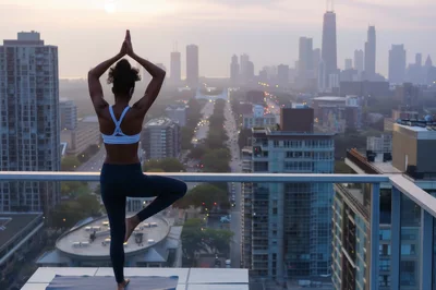 Woman Practicing Tree Pose Yoga on Rooftop at Sunset