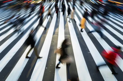 Motion Blur Pedestrians Crossing Busy City Intersection