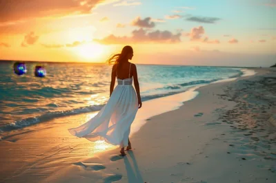 Woman In White Dress Walking On Tropical Beach