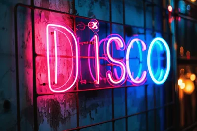 Neon Disco Sign Glowing On A Metal Grid Wall
