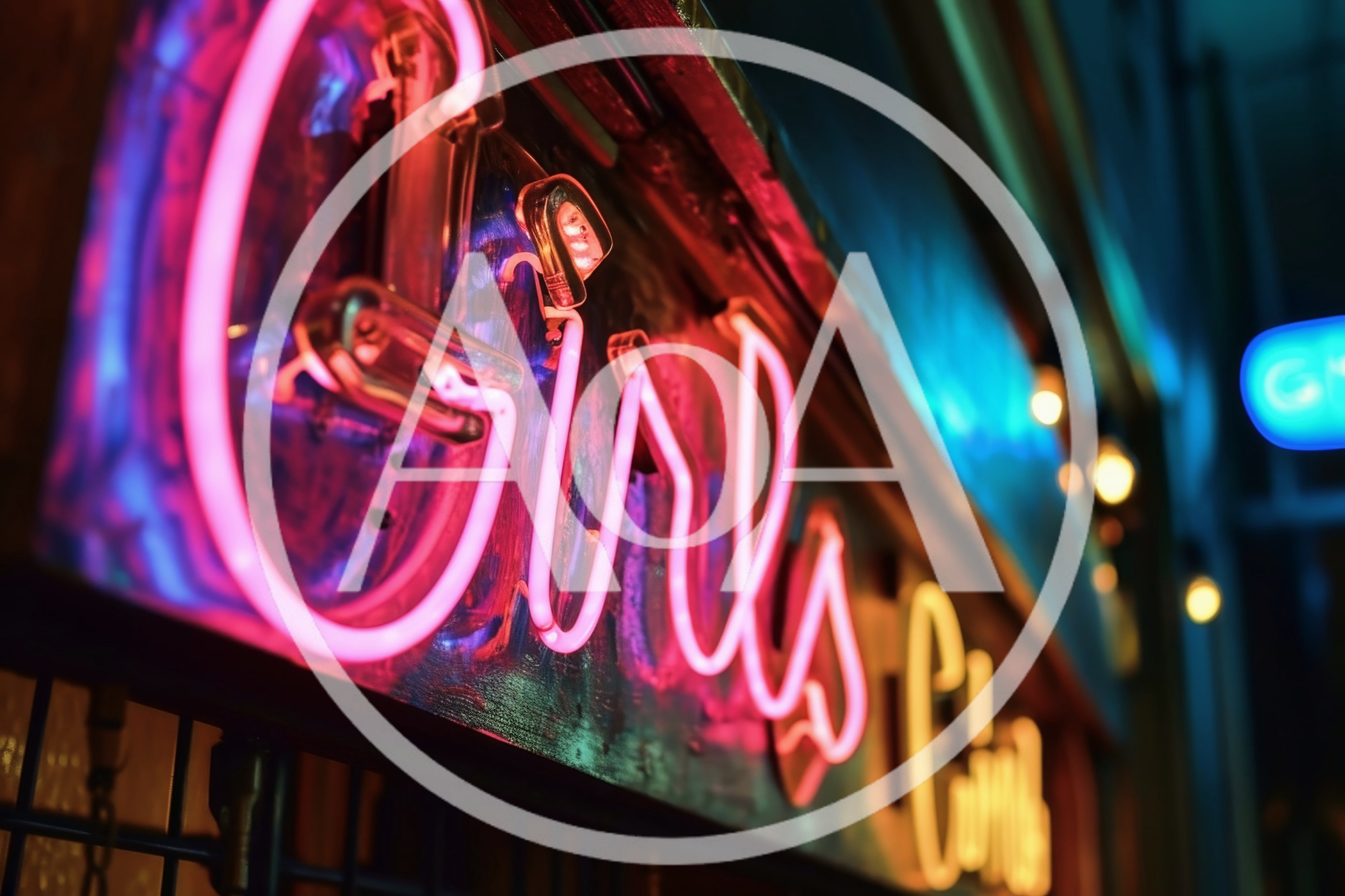 Neon Girls Sign Glowing In Nighttime City Street