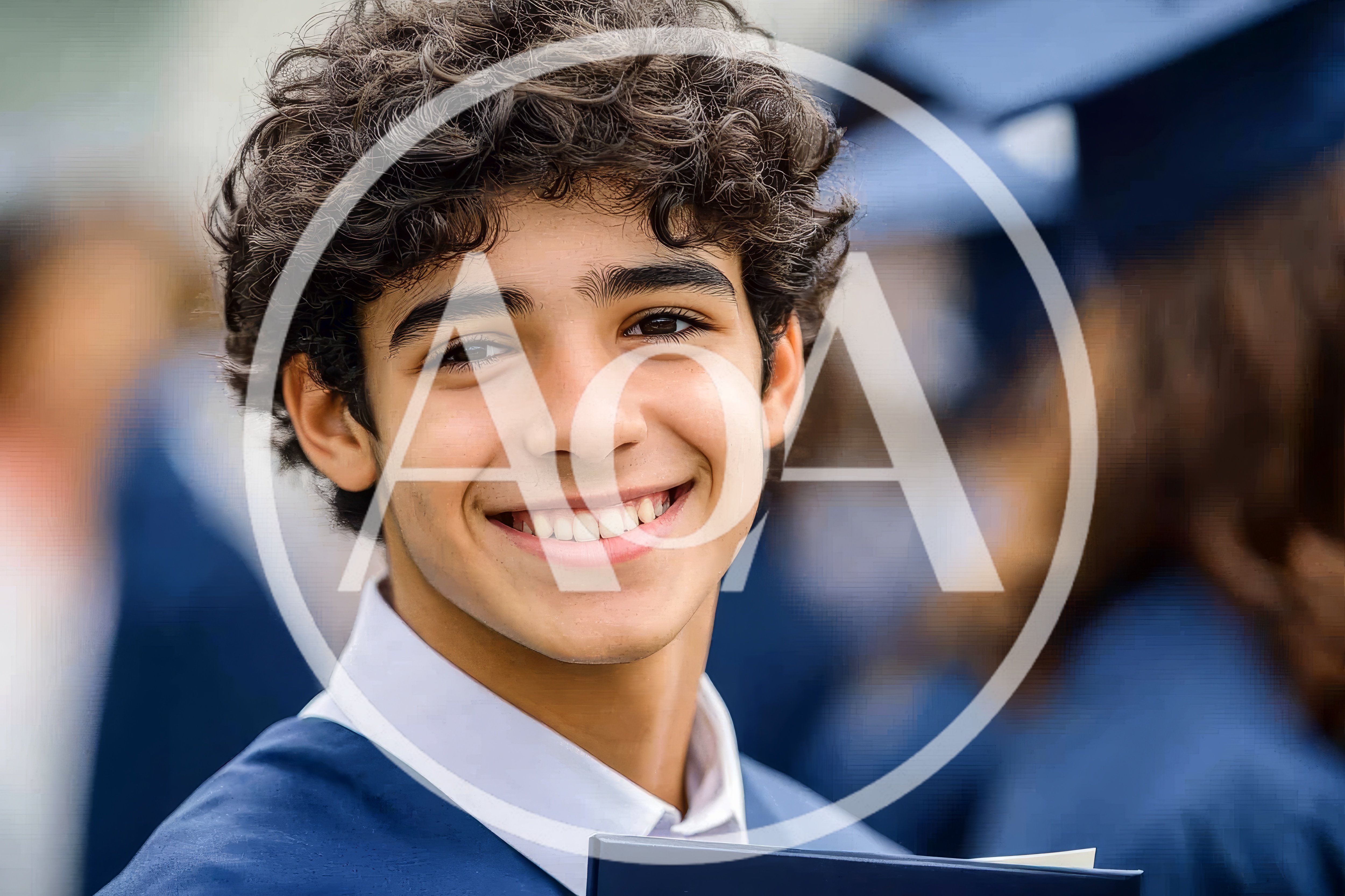 Portrait Of A Smiling Young Male Graduate
