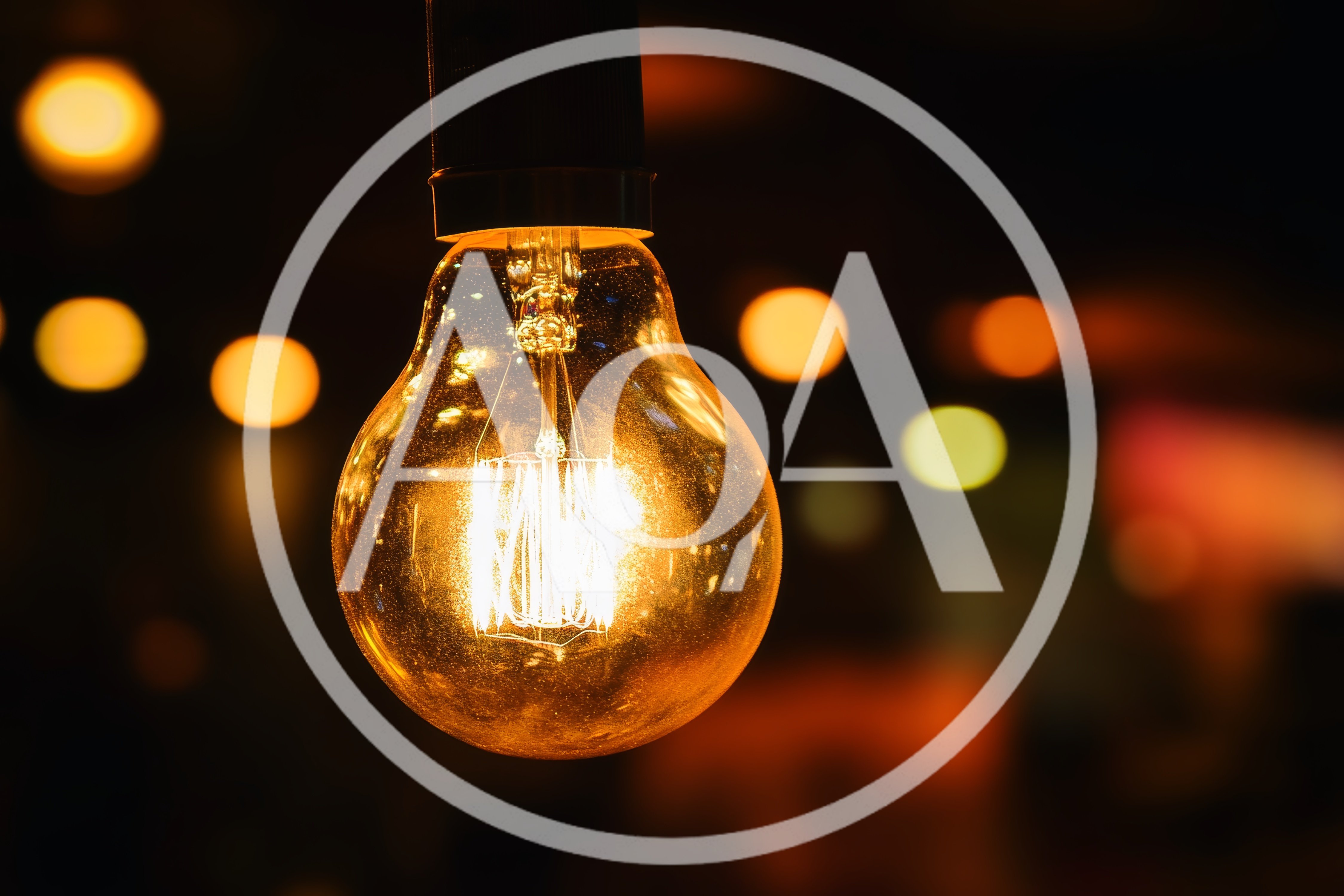 Glowing Vintage Edison Light Bulb Hanging In Dark Room