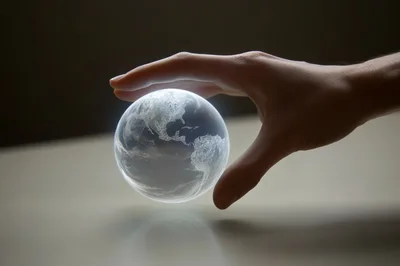 Human Hand Holding A Glowing Digital Earth Globe