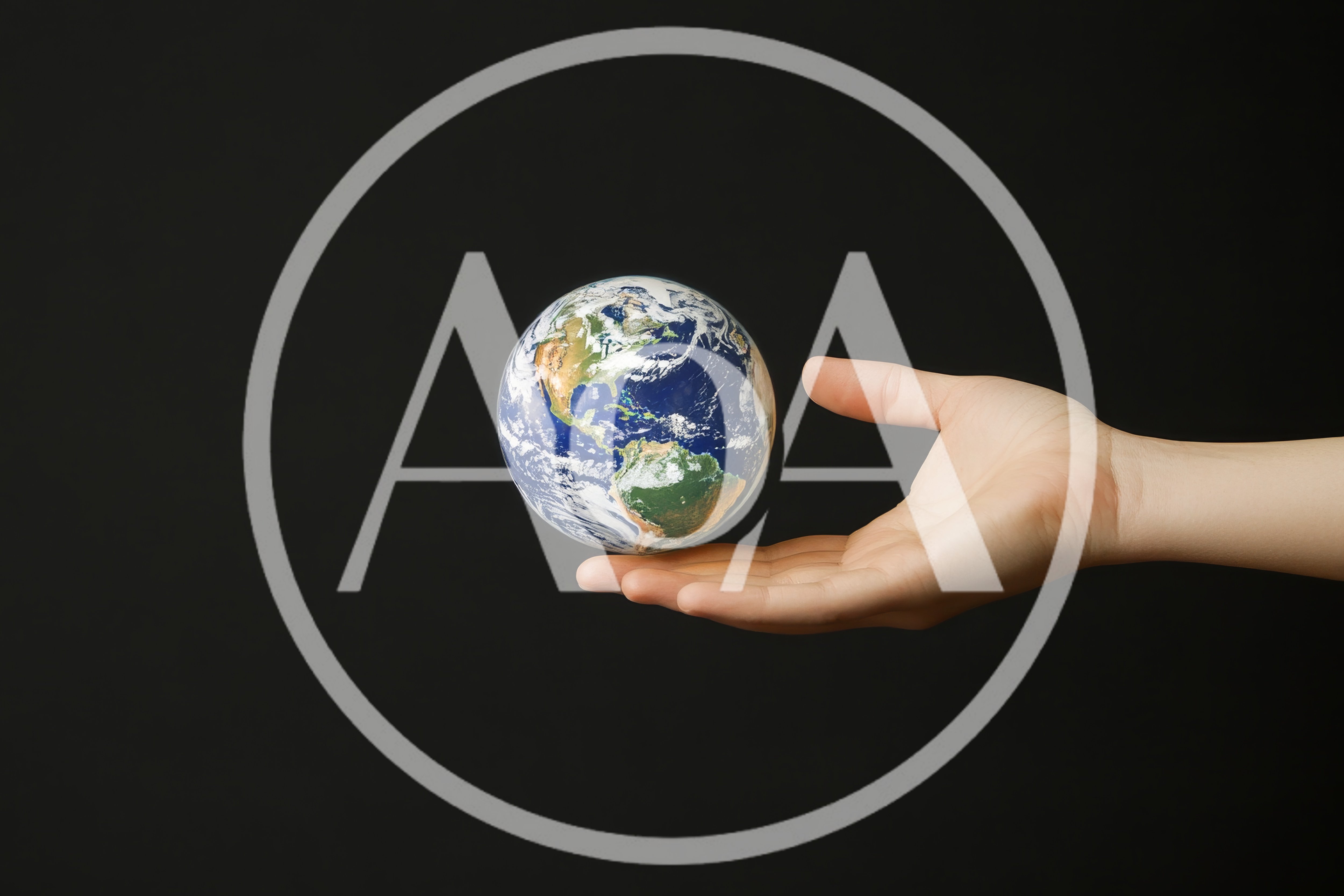 Human Hand Holding A Miniature Earth Globe