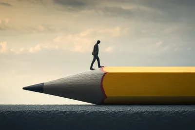 Businessman Walking On A Giant Pencil