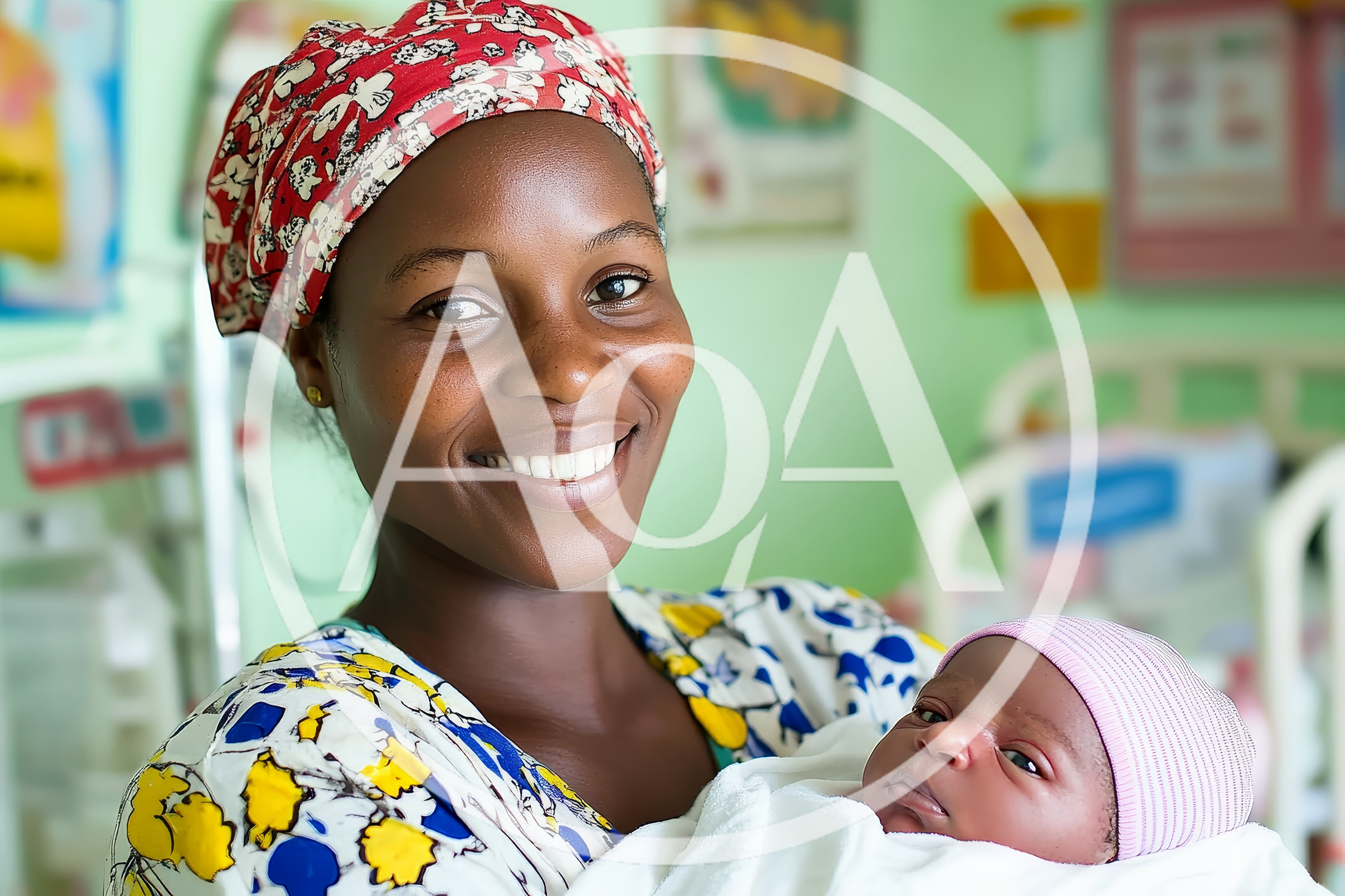 Happy Mother Holding Her Newborn Baby In Hospital