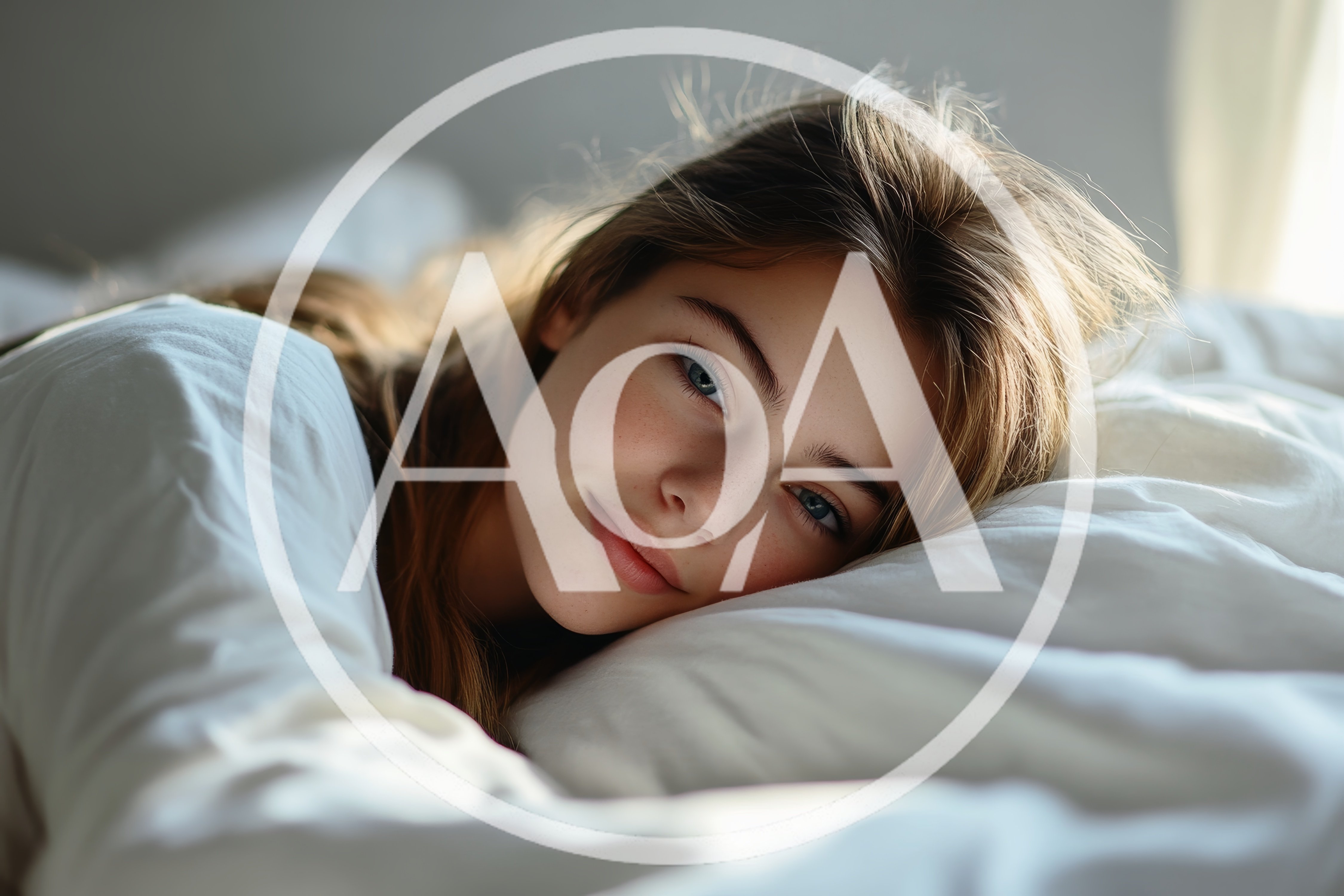 Young Woman Resting Comfortably On A White Bed
