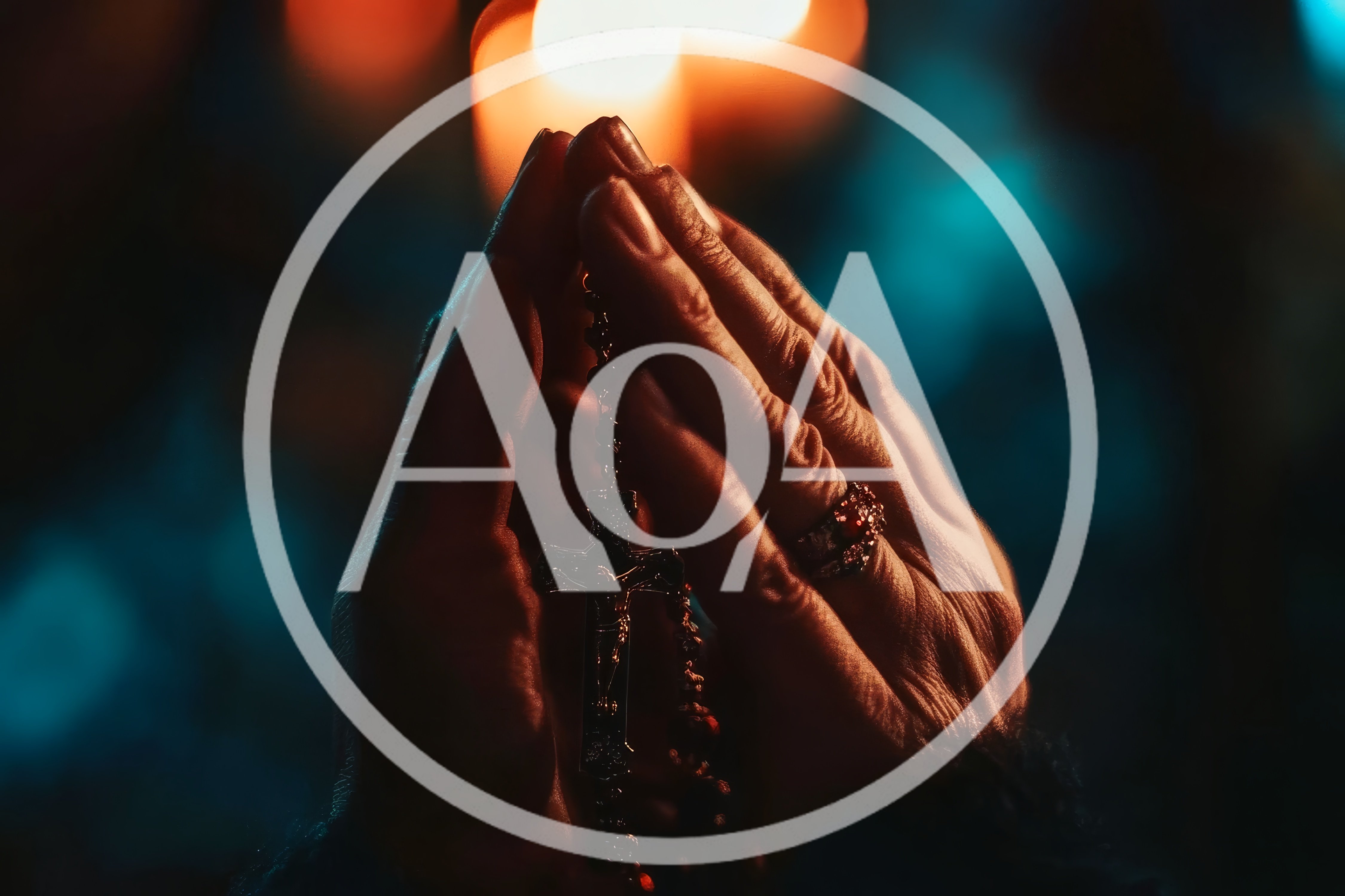 Close Up Of Hands Praying With A Rosary