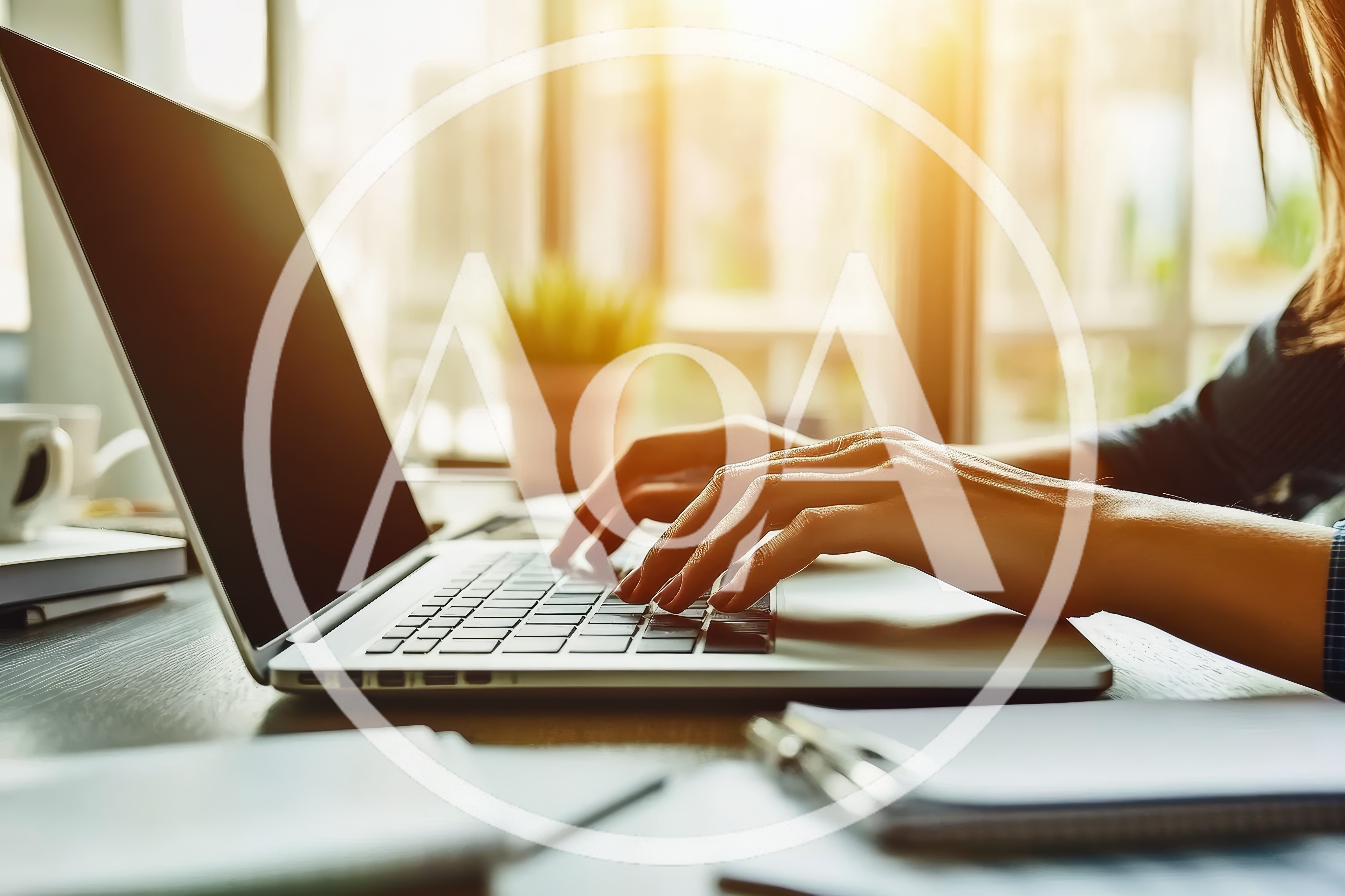 Woman Typing On Laptop In Sunny Office
