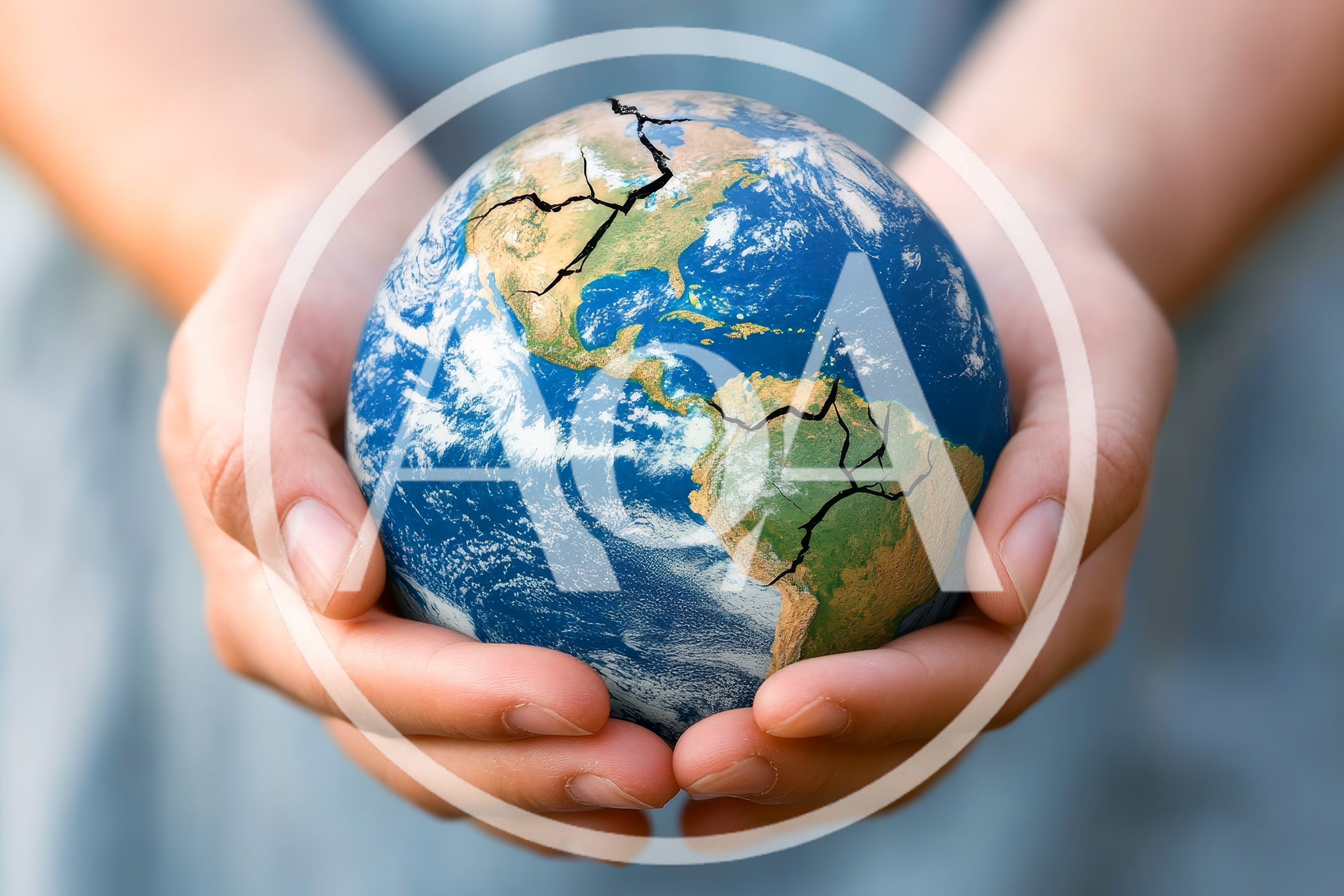 Human Hands Holding A Cracked Earth Globe