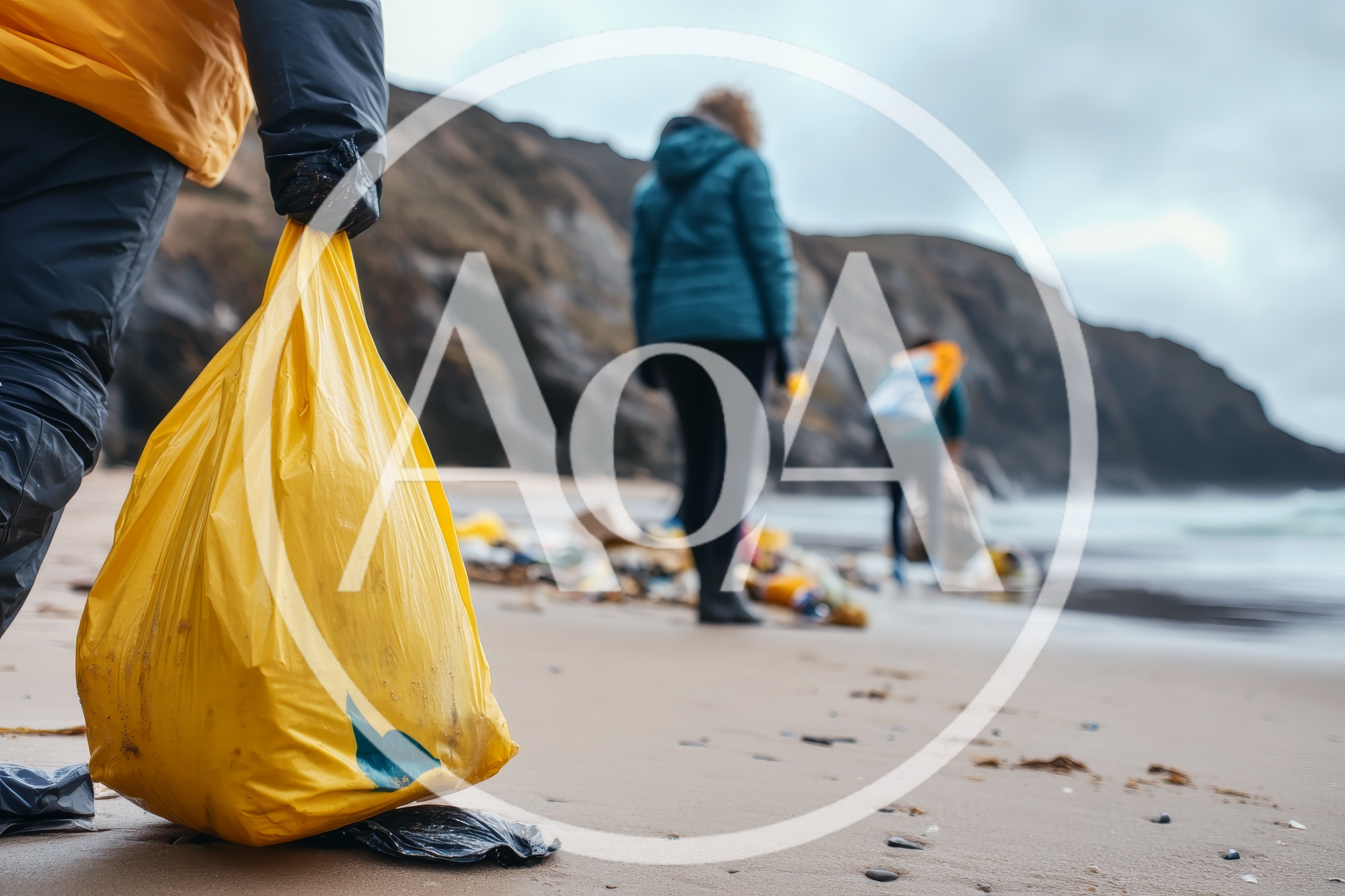 Volunteers Cleaning Plastic Waste From A Sandy Beach