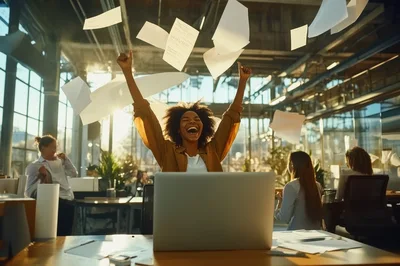 Excited Businesswoman Celebrating Success With Flying Papers