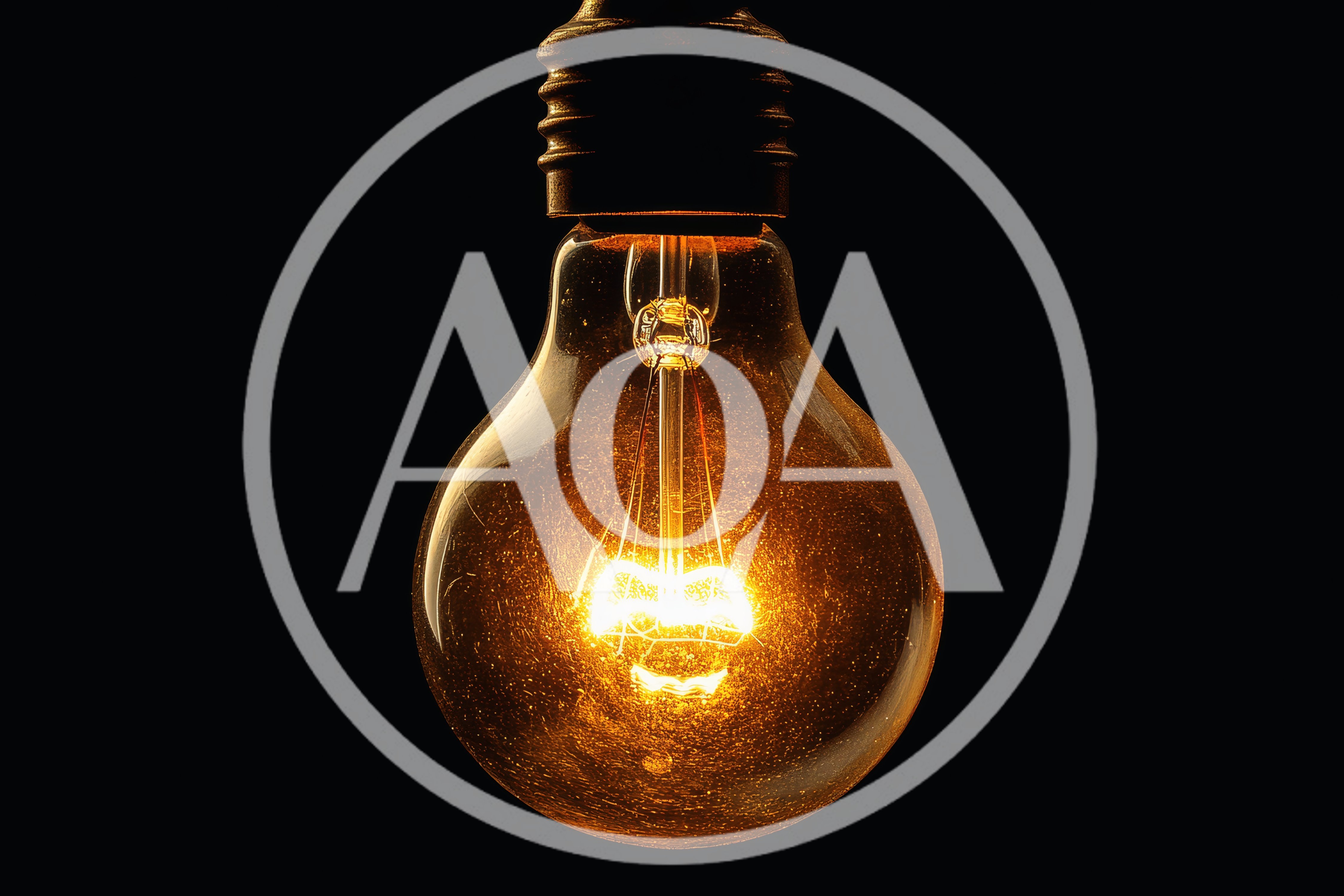 Glowing Incandescent Light Bulb Against Black Background