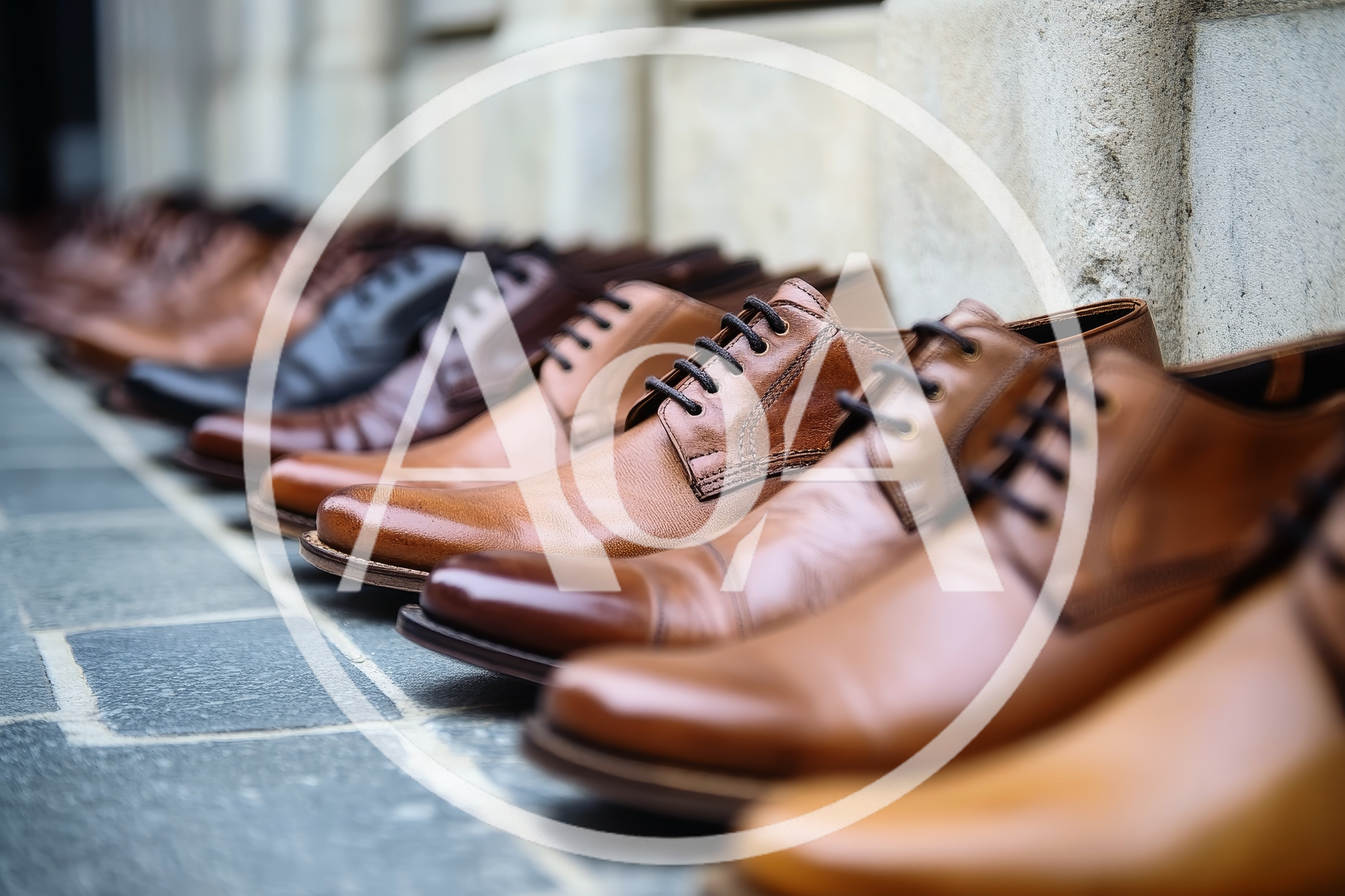 Row Of Classic Leather Dress Shoes On Stone Pavement