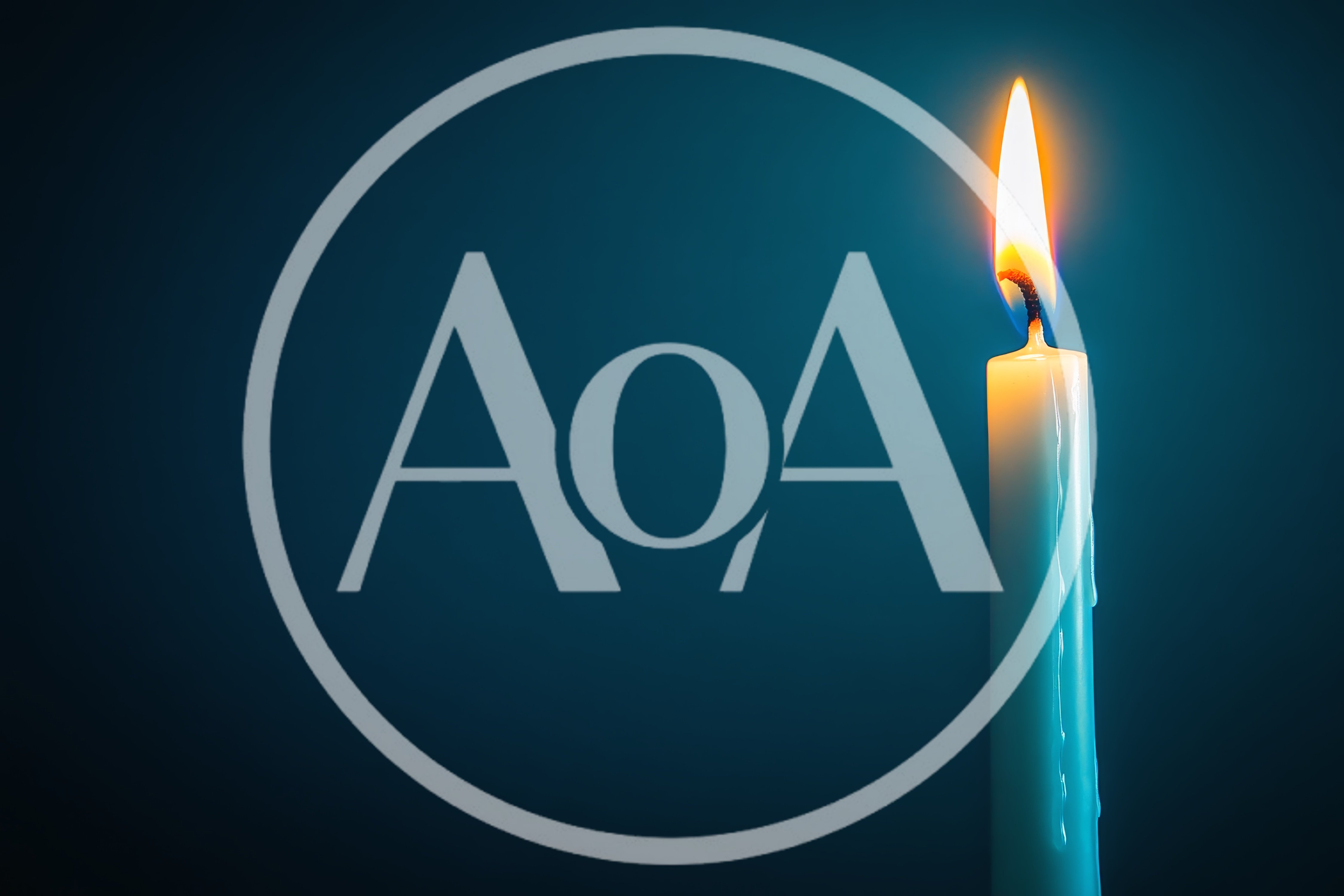 Single Lit Candle Against Dark Blue Background